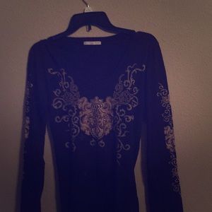 A black shirt with golden design